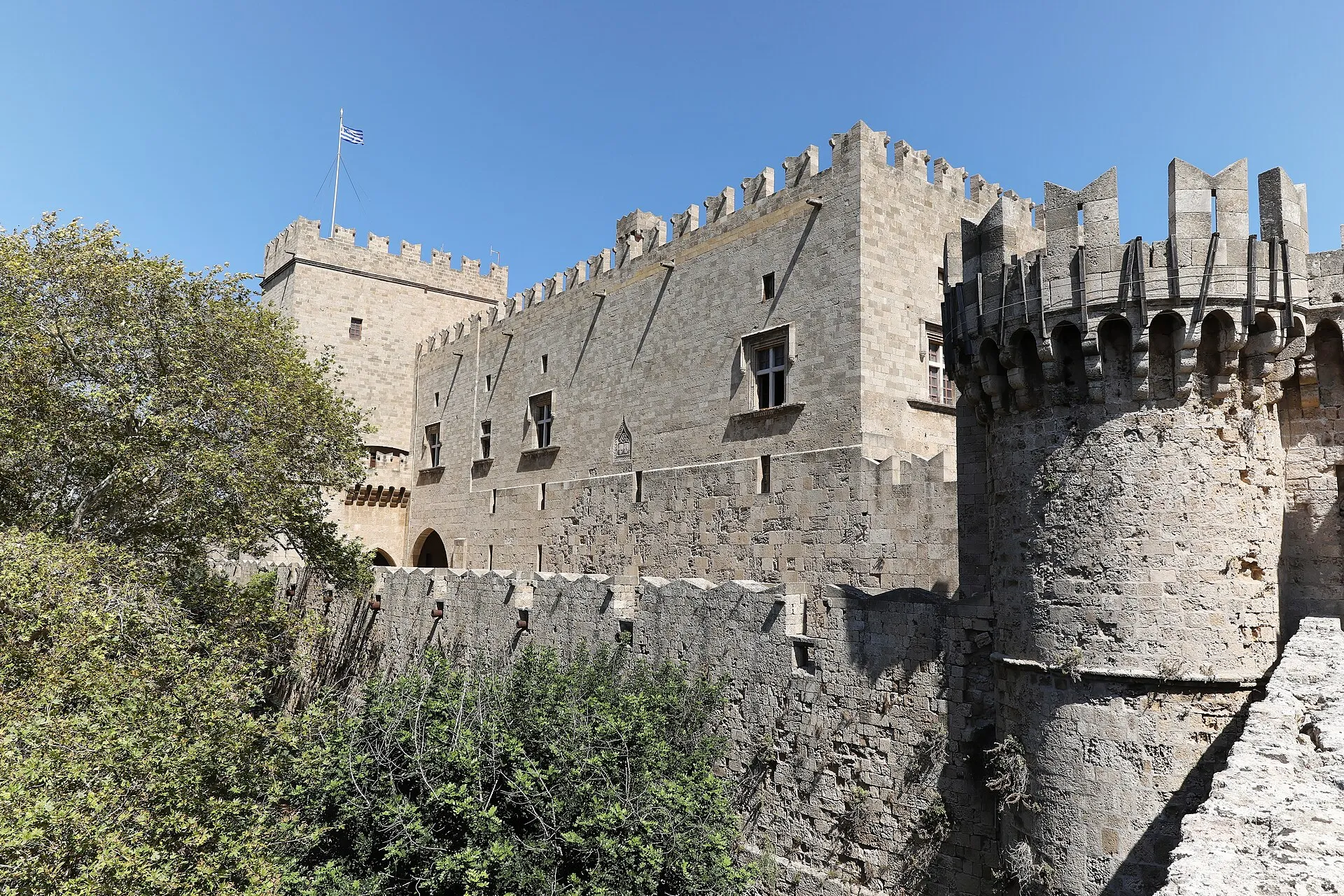 Gothic exterior of the Palace of the Grand Master of the Knights of Rhodes with crenellated towers and stone archway