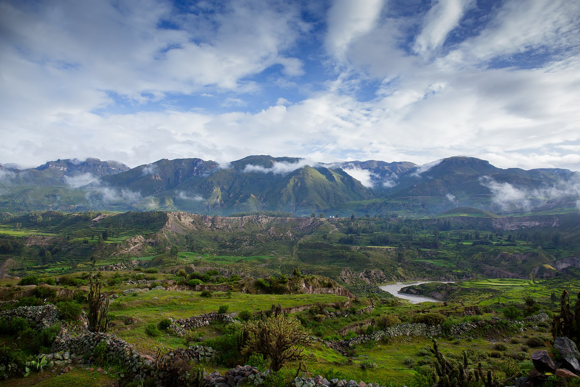 Dramatic landscape of Colca Canyon in Peru with deep valleys and terraced hillsides