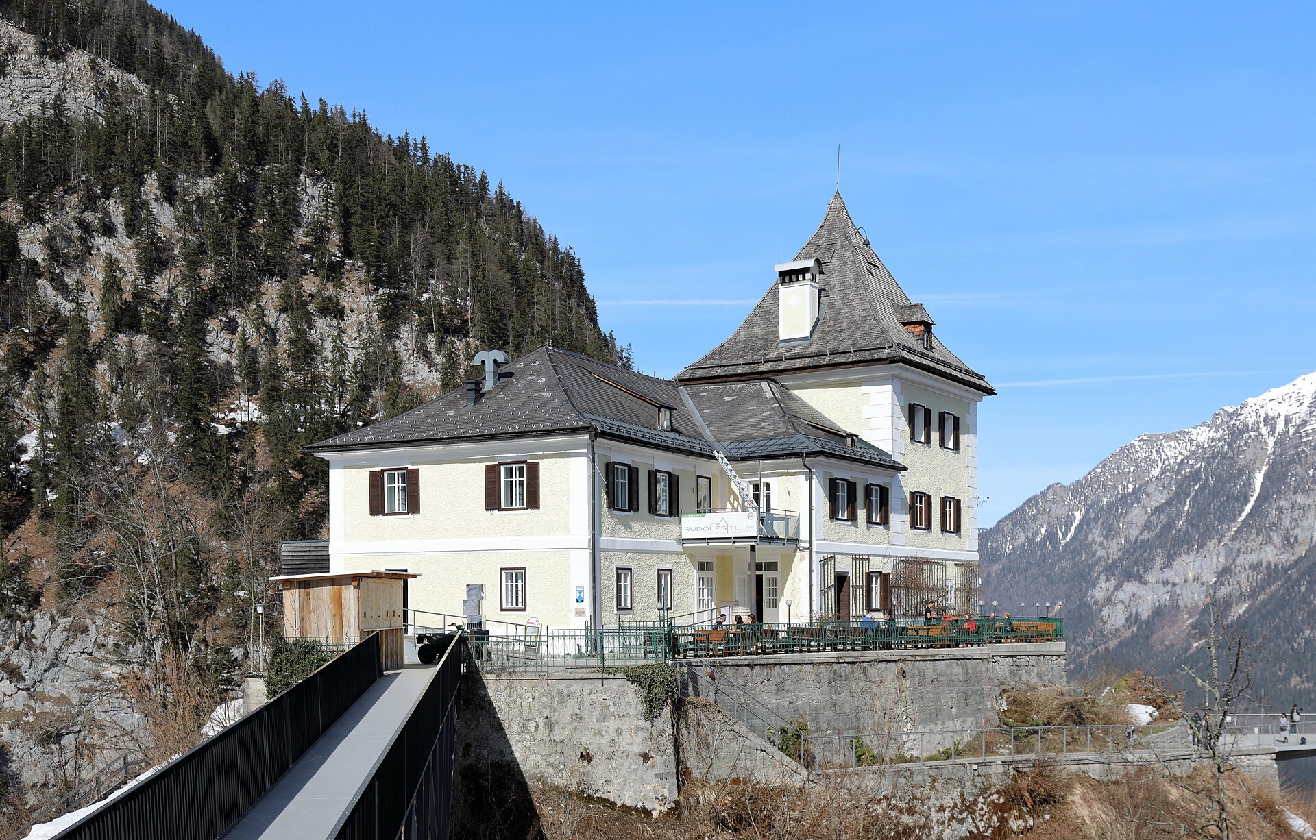 The Rudolfsturm tower perched above Hallstatt near the Skywalk viewing platform, offering views 350 meters above the village and lake