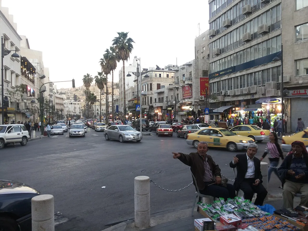 Faisal Street in Al-Balad downtown Amman with traditional shops and limestone buildings lining the road