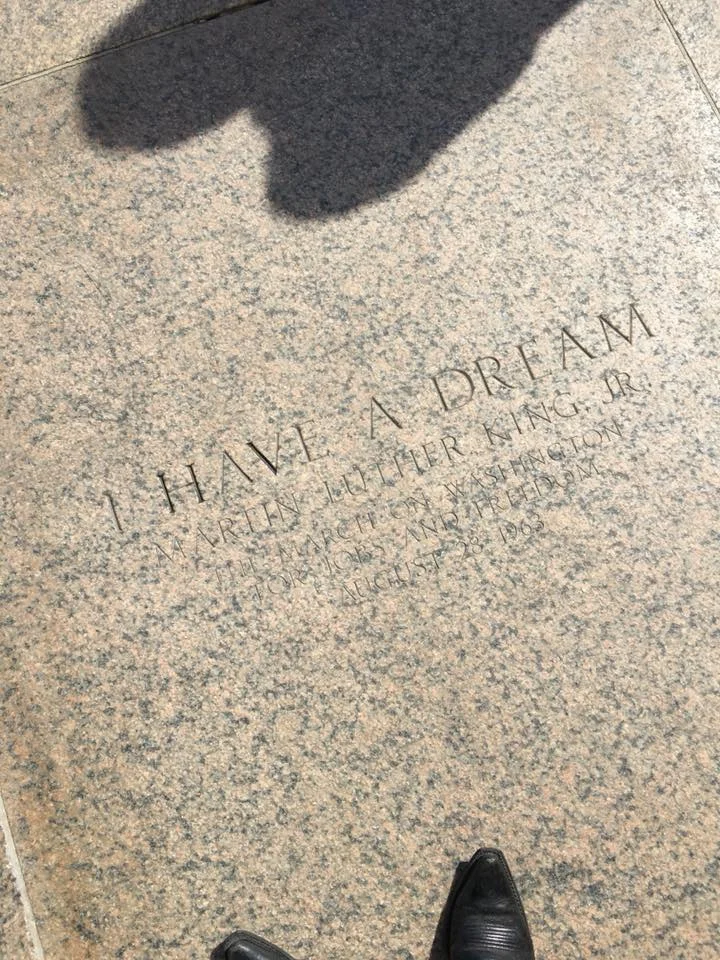 An 'I Have a Dream' inscription engraved into the granite landing of the Lincoln Memorial steps