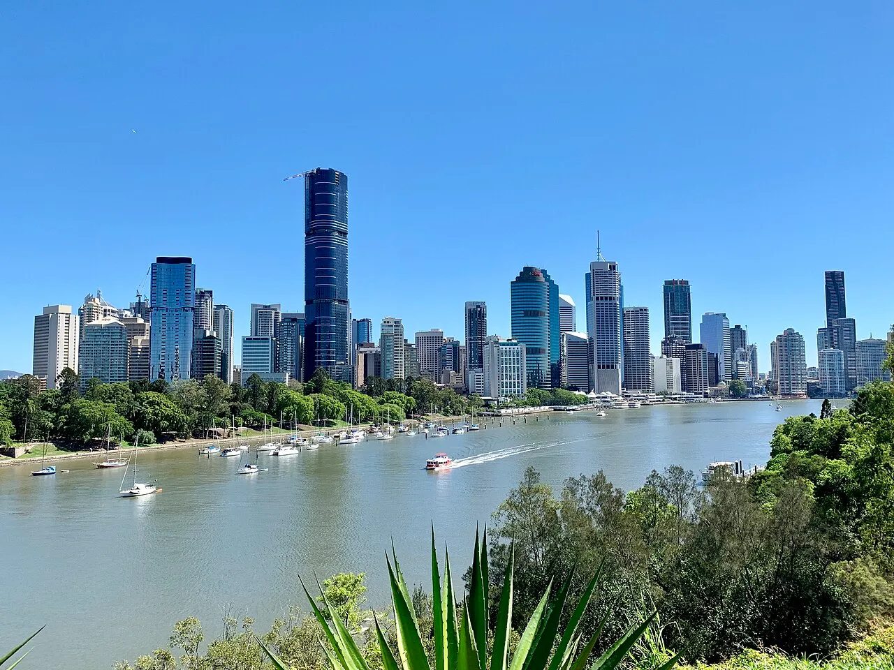 Brisbane city skyline reflected in the Brisbane River seen from Kangaroo Point cliffs