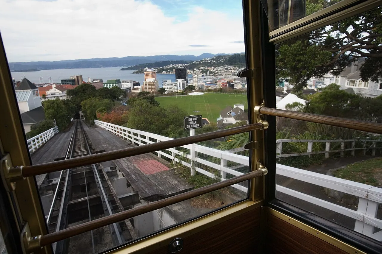 Wellington cable car leaving the top station with city views behind, New Zealand