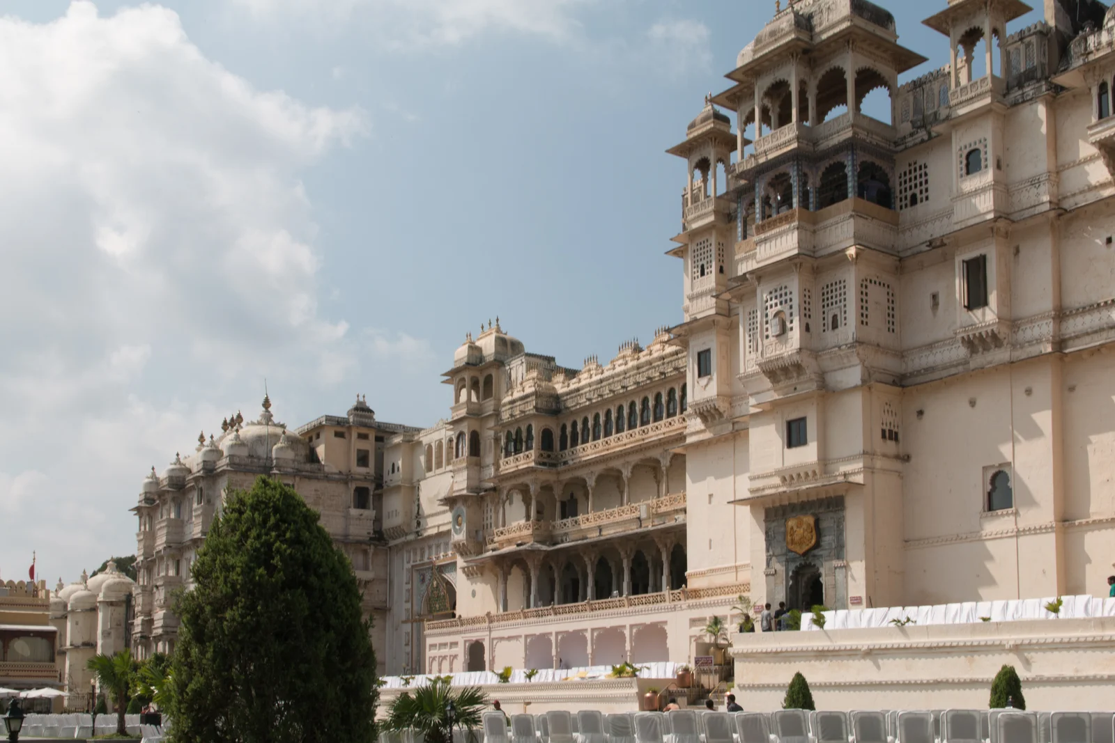 The wide Manek Chowk quadrangle inside City Palace Udaipur with the palace facade rising behind it