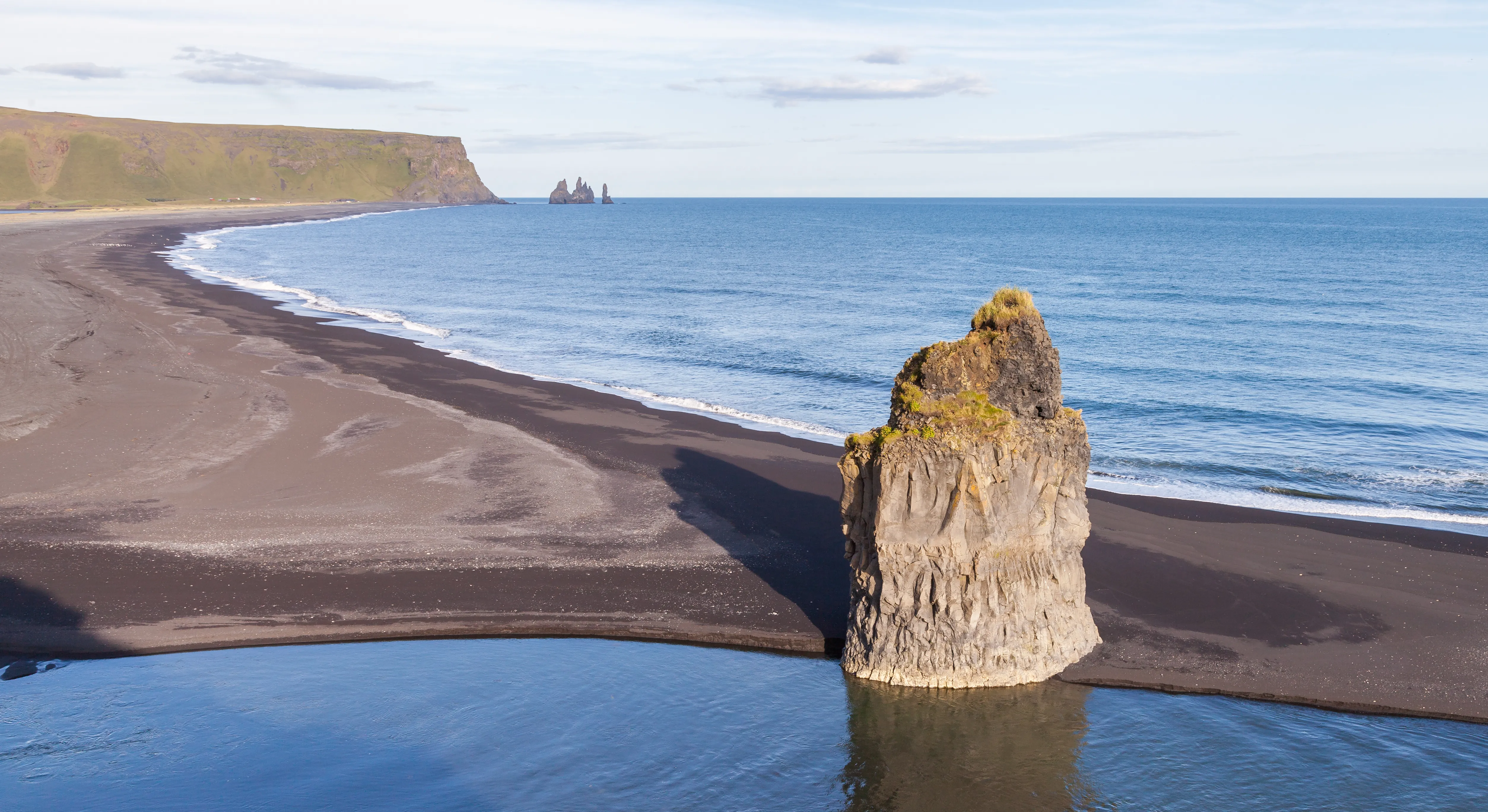 Reynisfjara black sand beach near Vík, Iceland, with its dramatic basalt columns and sea stacks