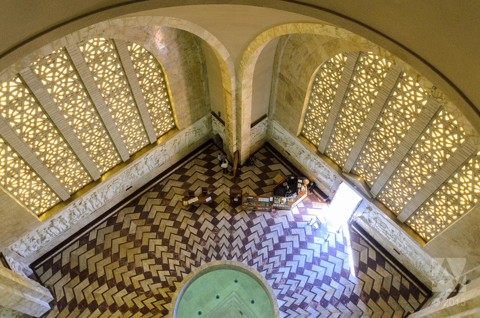 Overhead view inside the Voortrekker Monument's Hall of Heroes, showing the patterned marble floor and the circular opening down to the Cenotaph