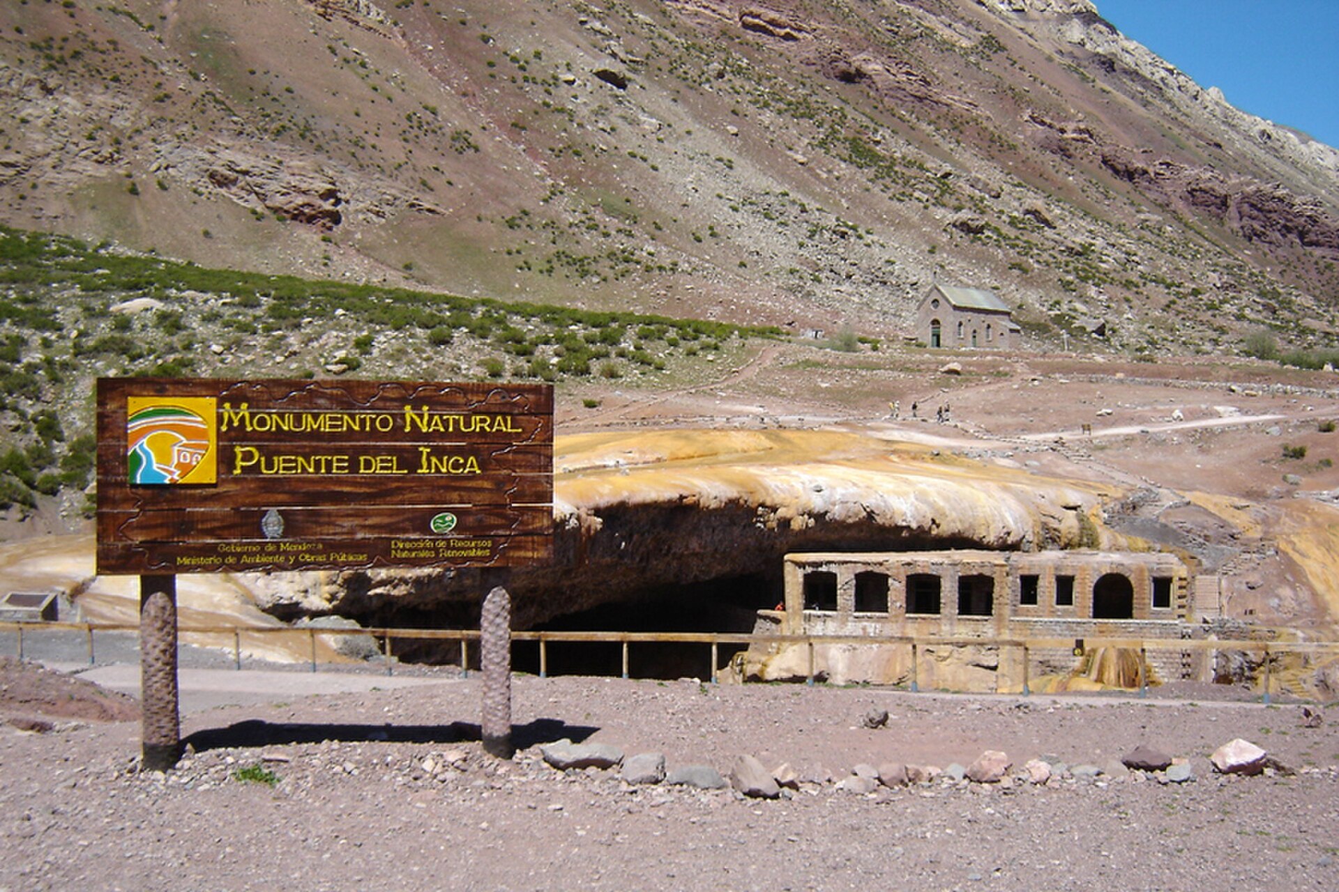 The natural rock bridge of Puente del Inca spanning the Las Cuevas River with yellow-orange mineral deposits
