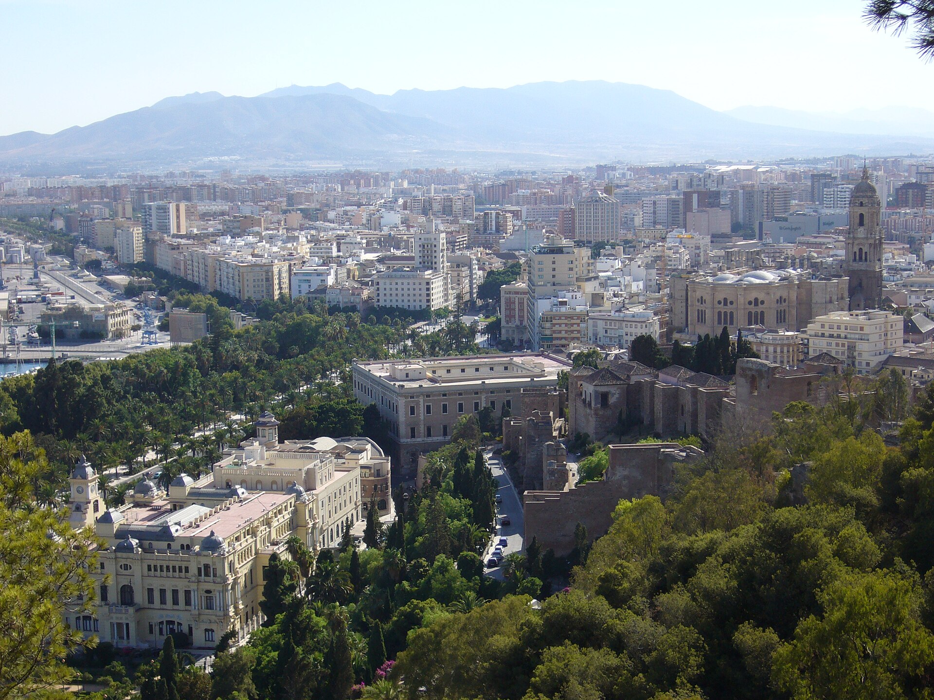 Málaga harbor and cityscape with the Alcazaba on the hillside