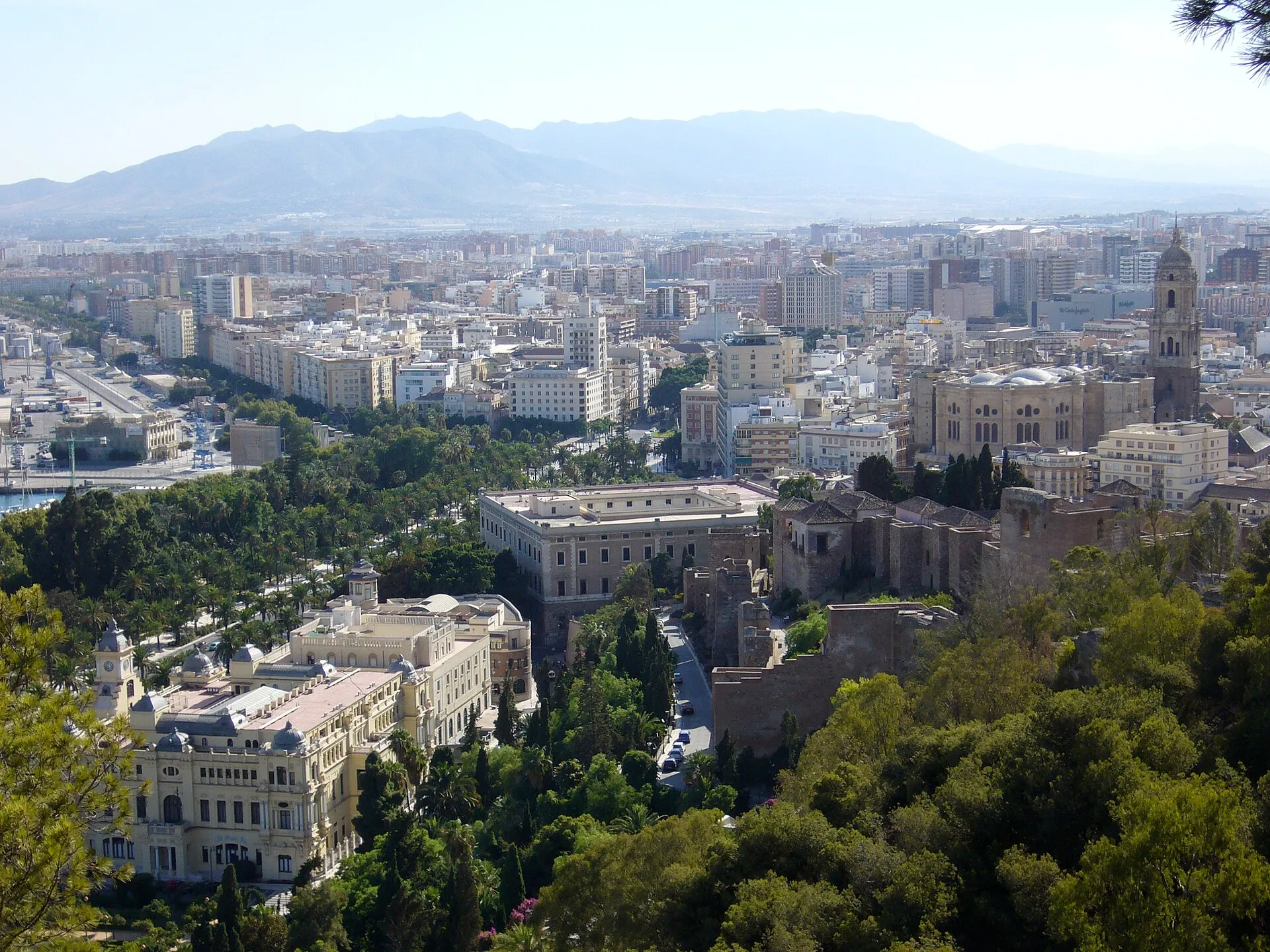 Málaga harbor and cityscape with the Alcazaba on the hillside