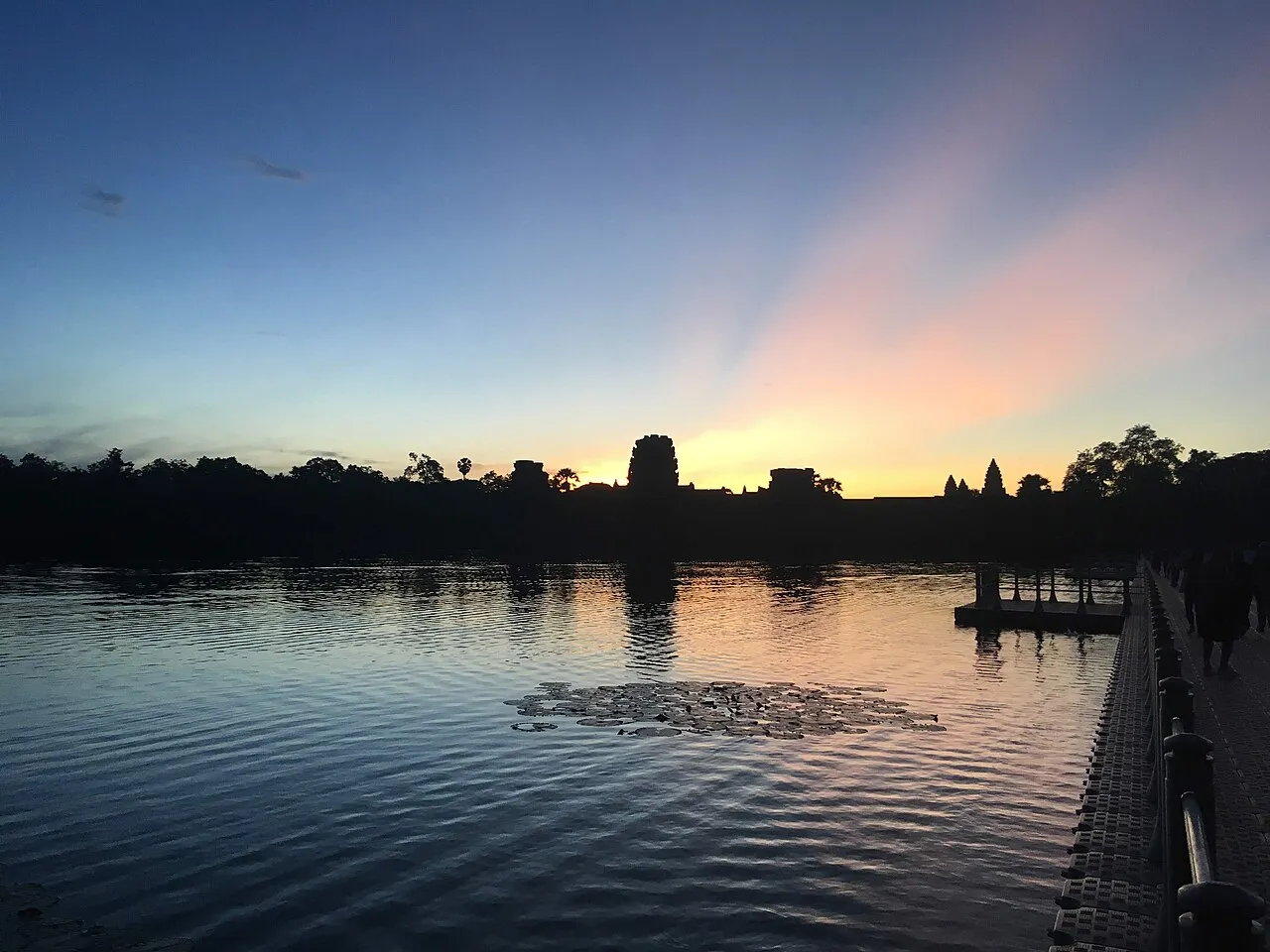 Angkor Wat temple towers reflected in the moat at sunrise, Siem Reap, Cambodia