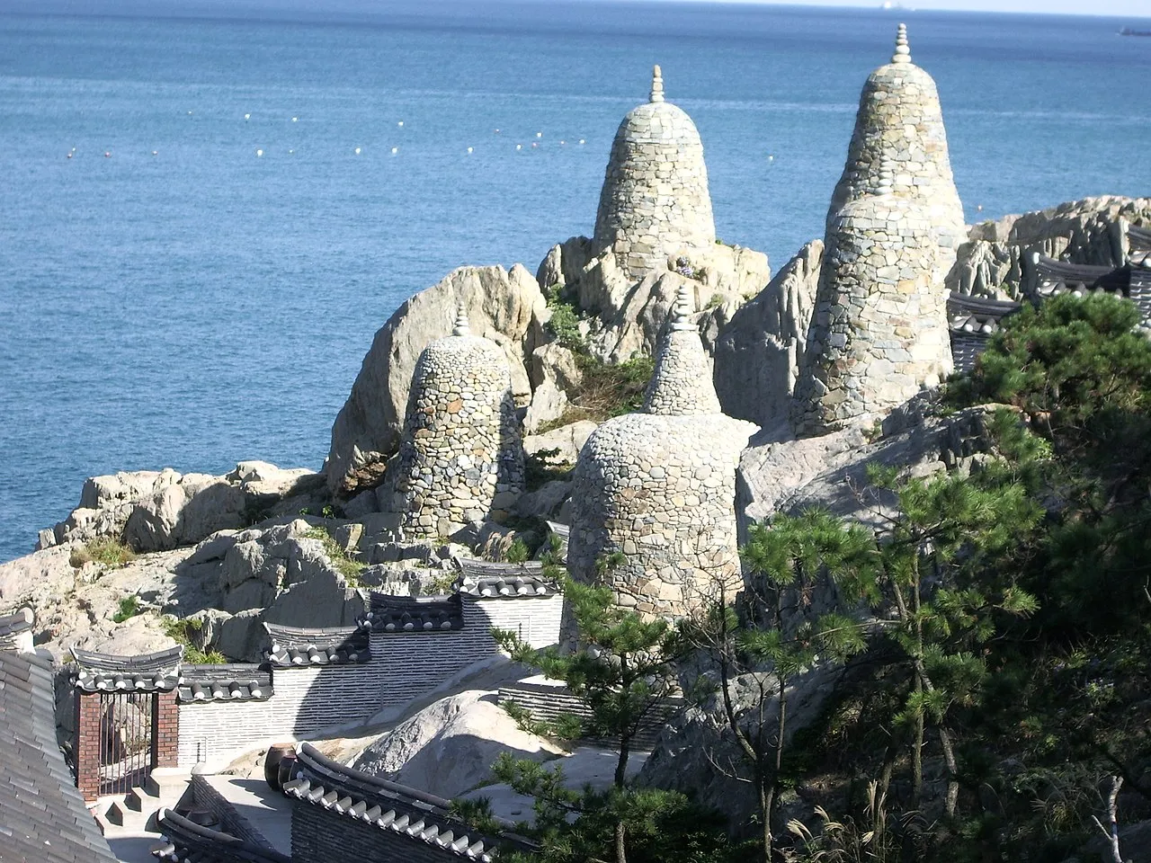 Haedong Yonggungsa Temple pagoda and pavilions on rocky coastal cliffs in Busan