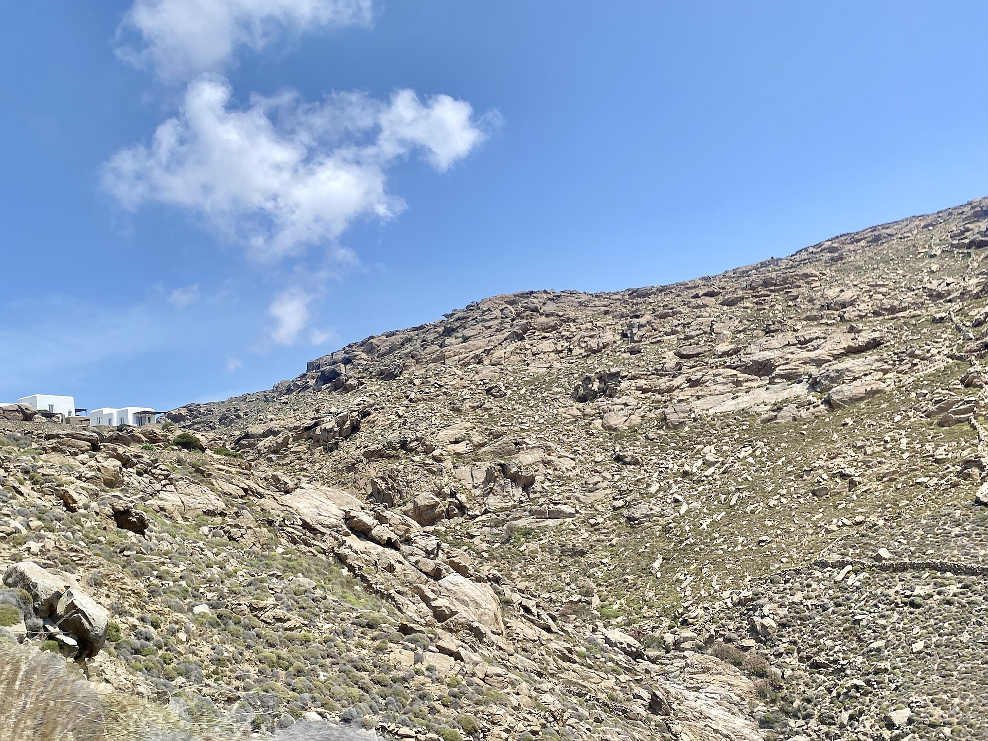 Rural landscape with traditional whitewashed buildings on Mykonos island, Greece