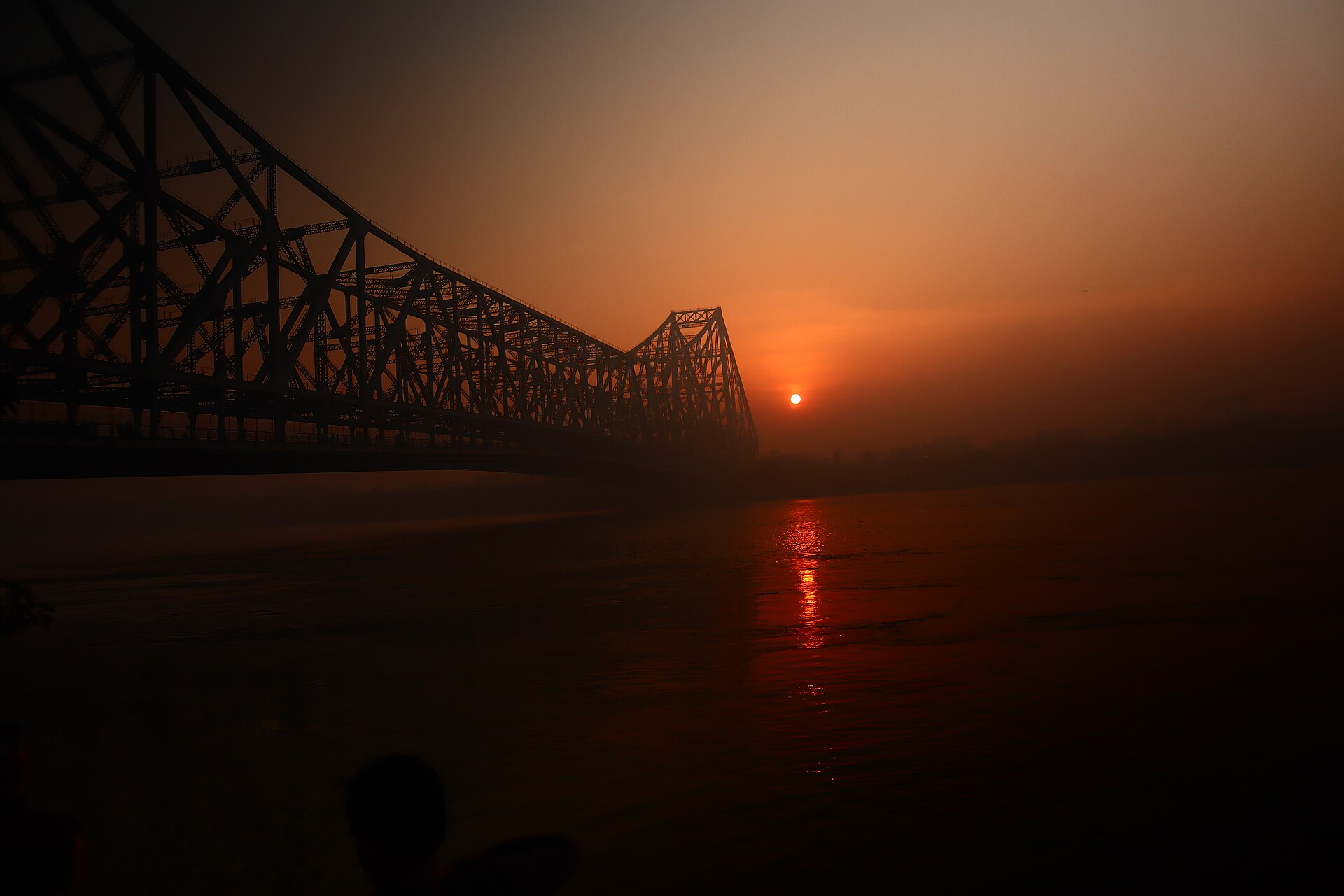 Sunrise over Howrah Bridge and the Hooghly River in Kolkata