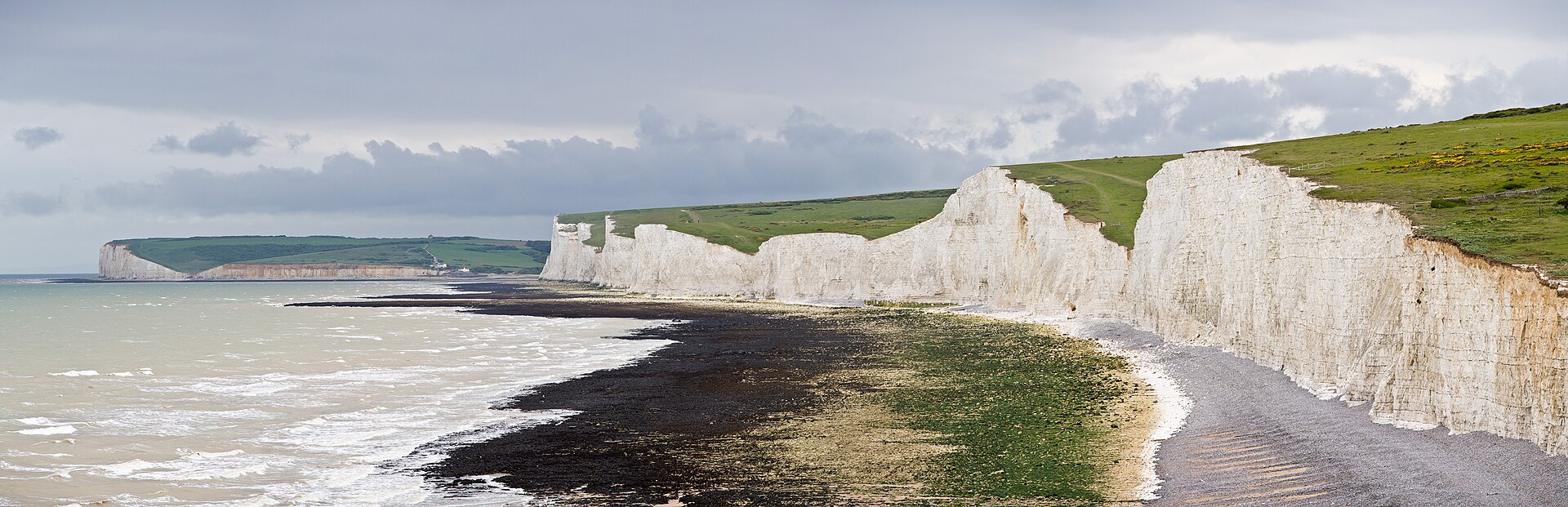 Panoramic view of the Seven Sisters chalk cliffs along the East Sussex coast in England