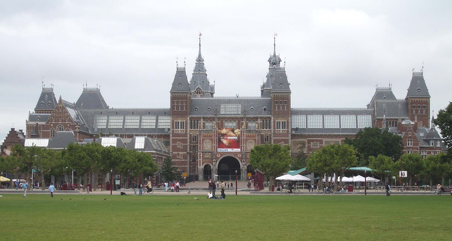 The Rijksmuseum building in Amsterdam reflected in its garden pool