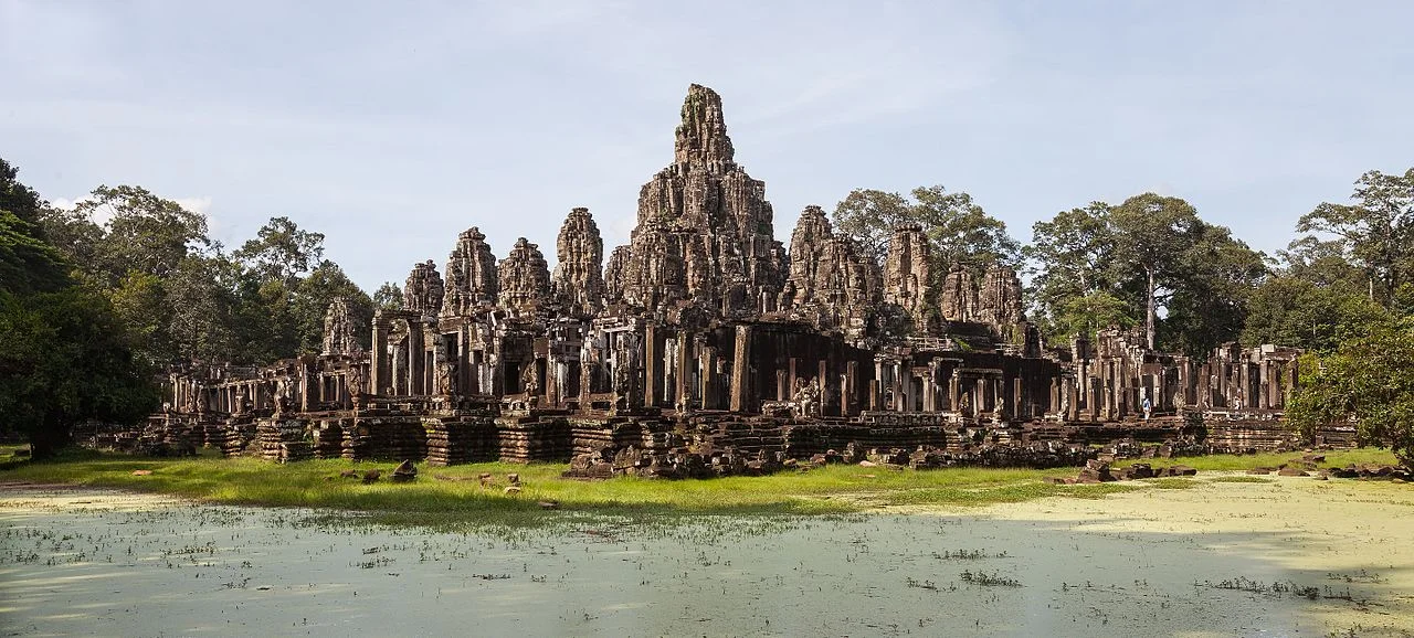 The Bayon temple at Angkor Thom with its many stone face towers rising above the jungle canopy