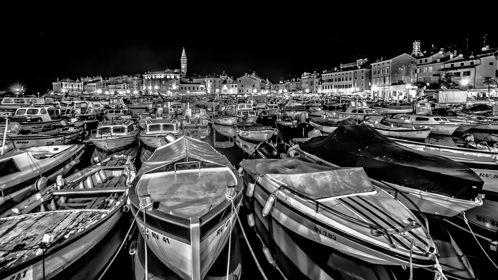 Rovinj's old town peninsula rising from the Adriatic, its stacked pastel houses crowned by the campanile of St Euphemia