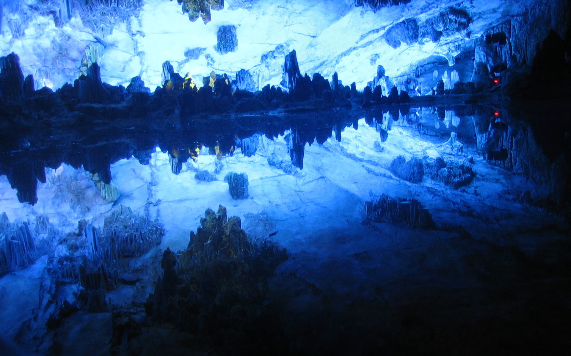 Colorfully illuminated stalactites inside Reed Flute Cave in Guilin