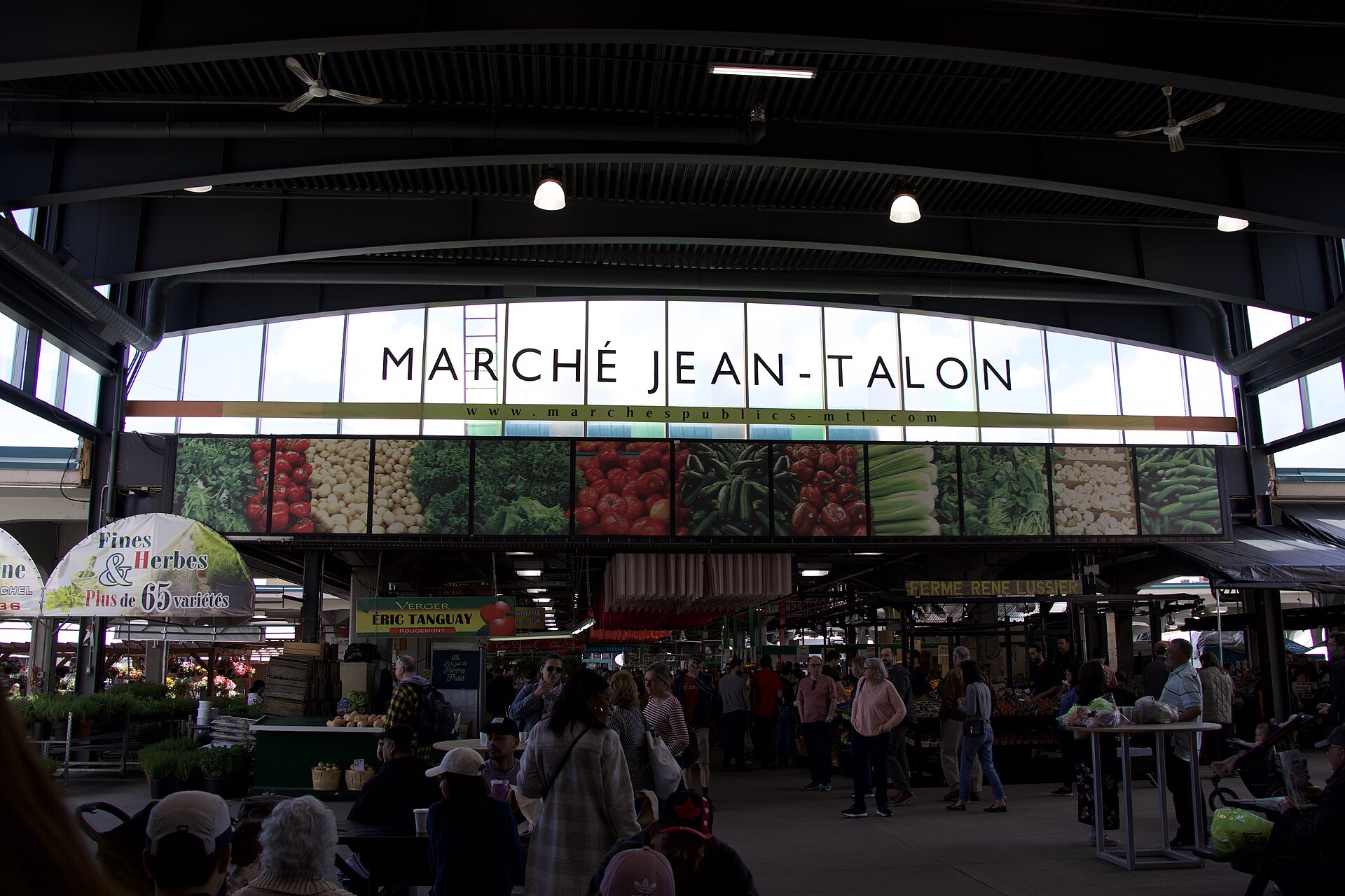 Interior of Jean-Talon Market with vendors and shoppers, Montreal