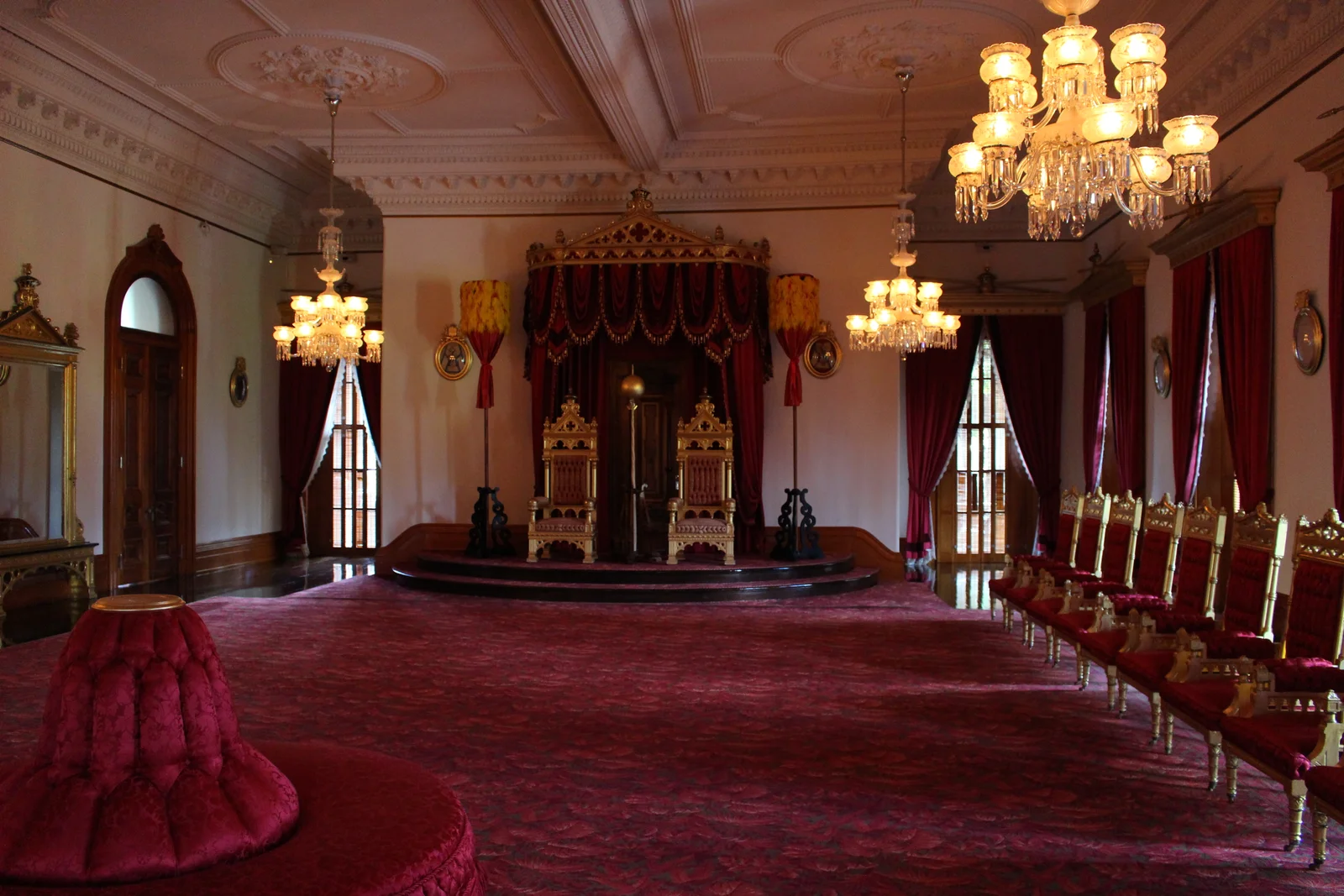 The Throne Room inside Iolani Palace, with two gilded thrones set on a low dais