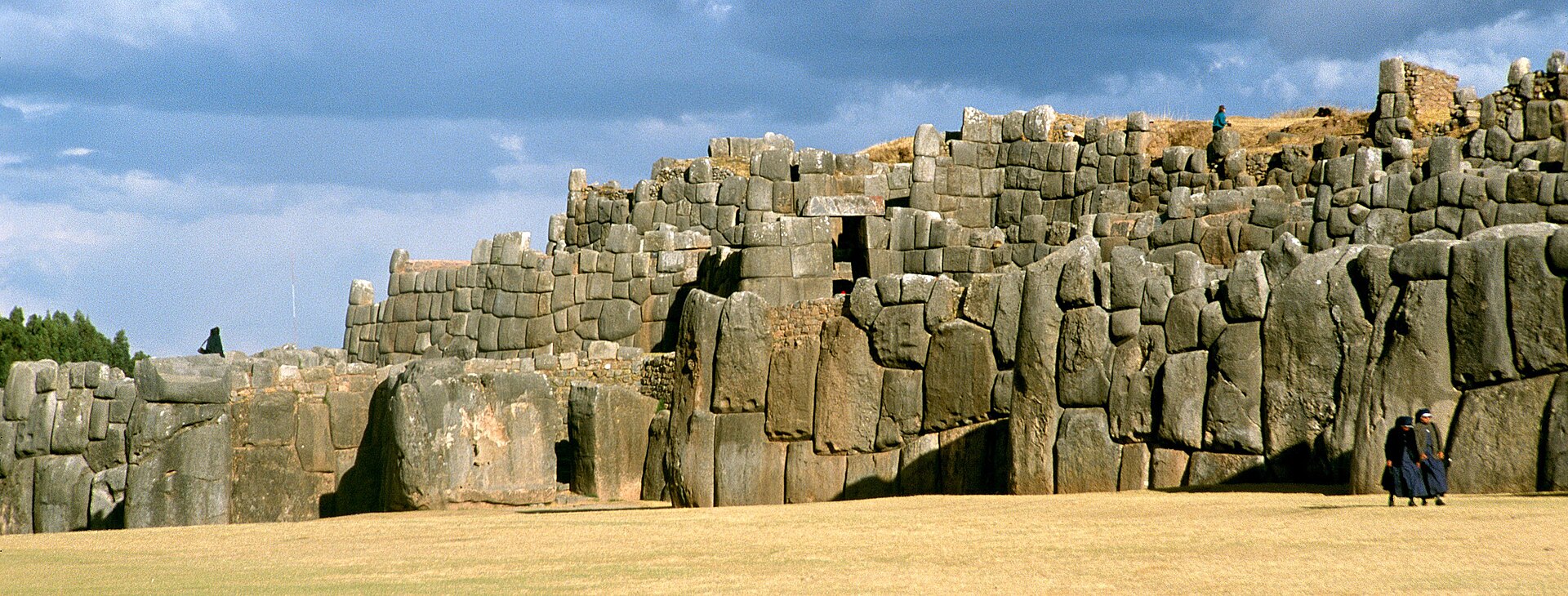The massive zigzag stone walls of the Sacsayhuaman Inca fortress in Cusco, Peru, built with precisely fitted megalithic blocks