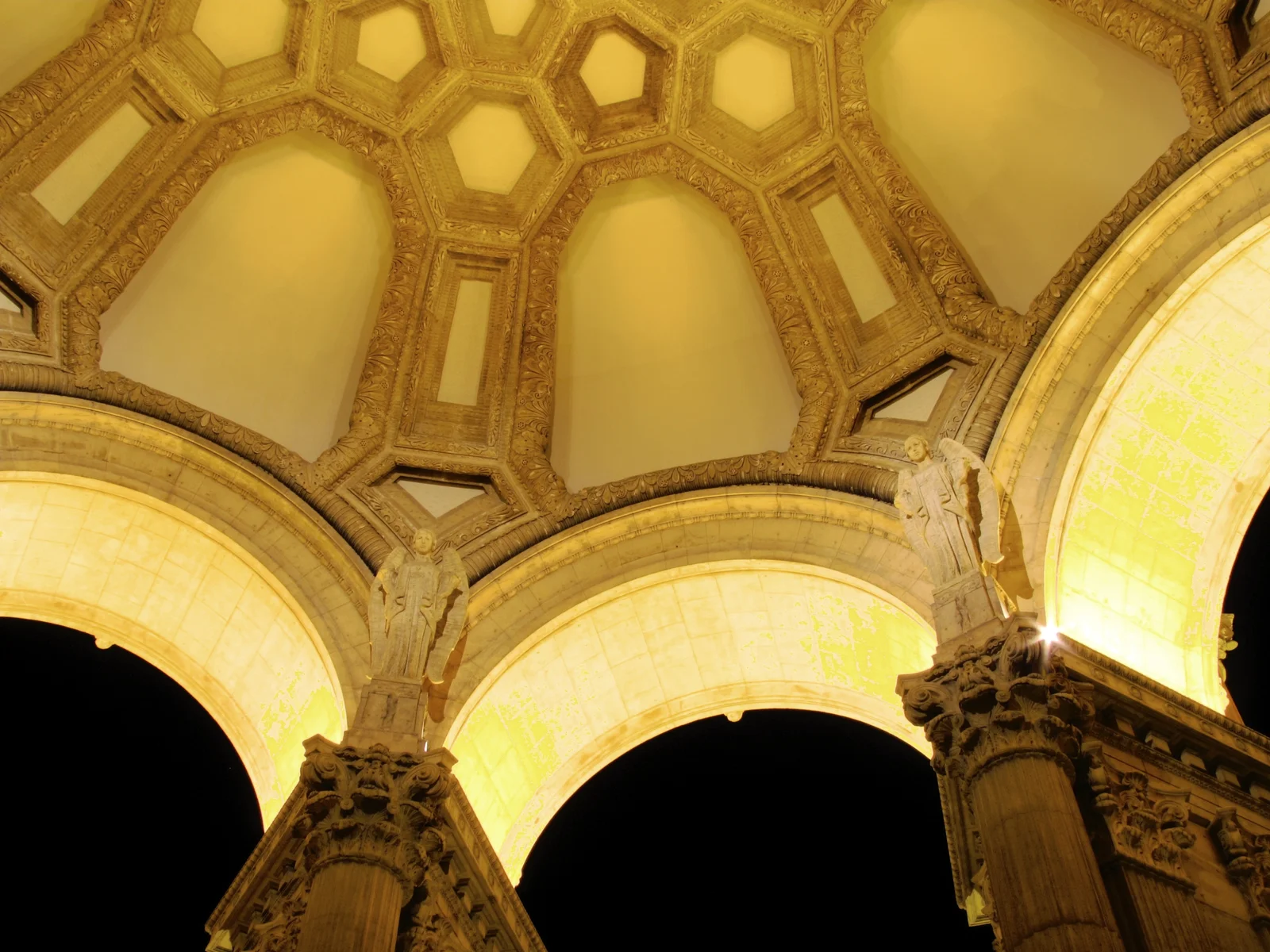 Looking straight up into the open coffered dome of the Palace of Fine Arts rotunda, its octagonal panels drawing the eye skyward