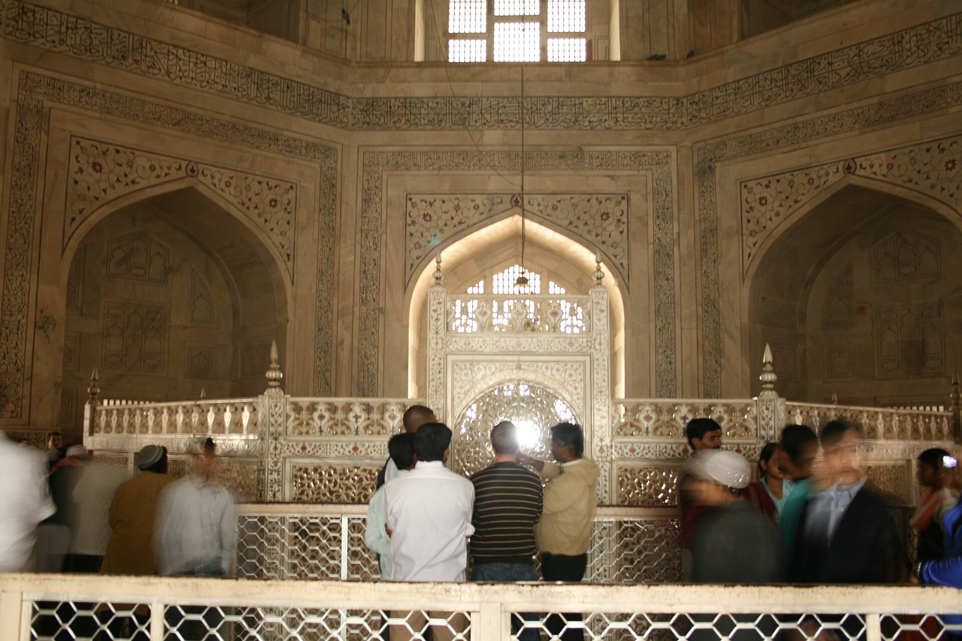 The Taj Mahal and its reflecting pool seen from the main gateway in Agra